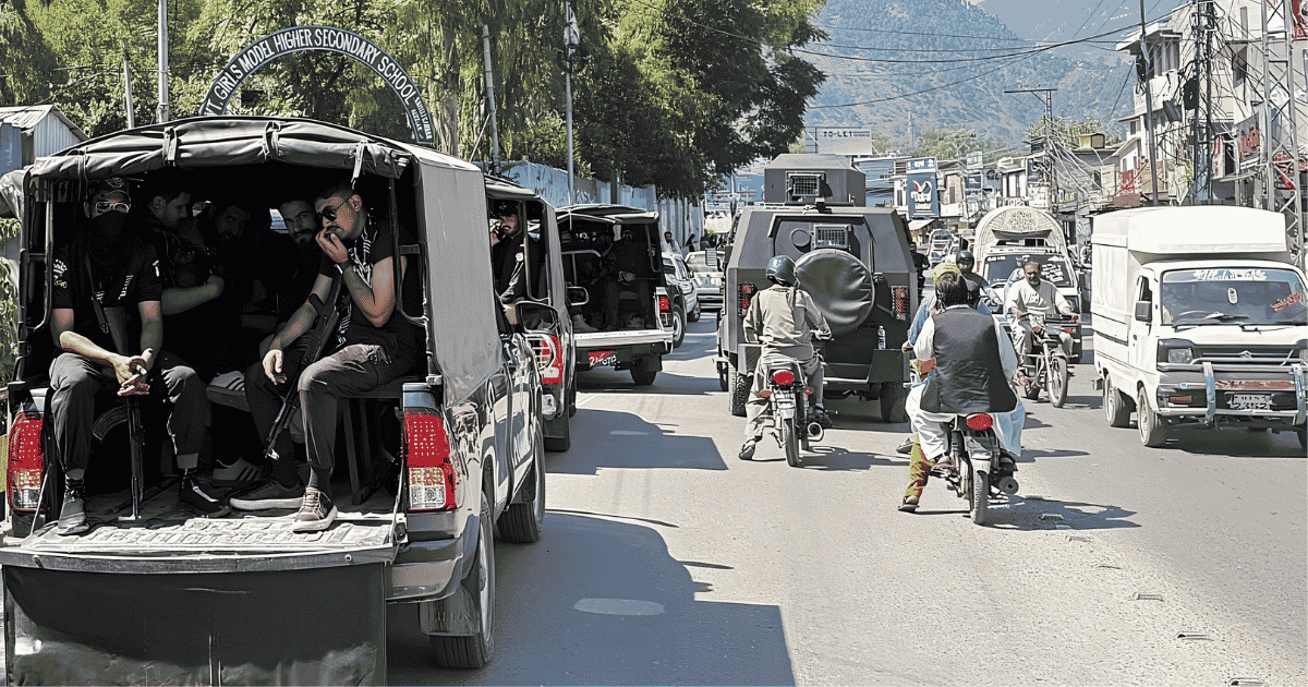 Security forces patrol a street in Rawalakot during the Pakistan-Occupied Kashmir protest movement in June 2026 following the ban on the Jammu Kashmir Joint Awami Action Committee (JAAC).