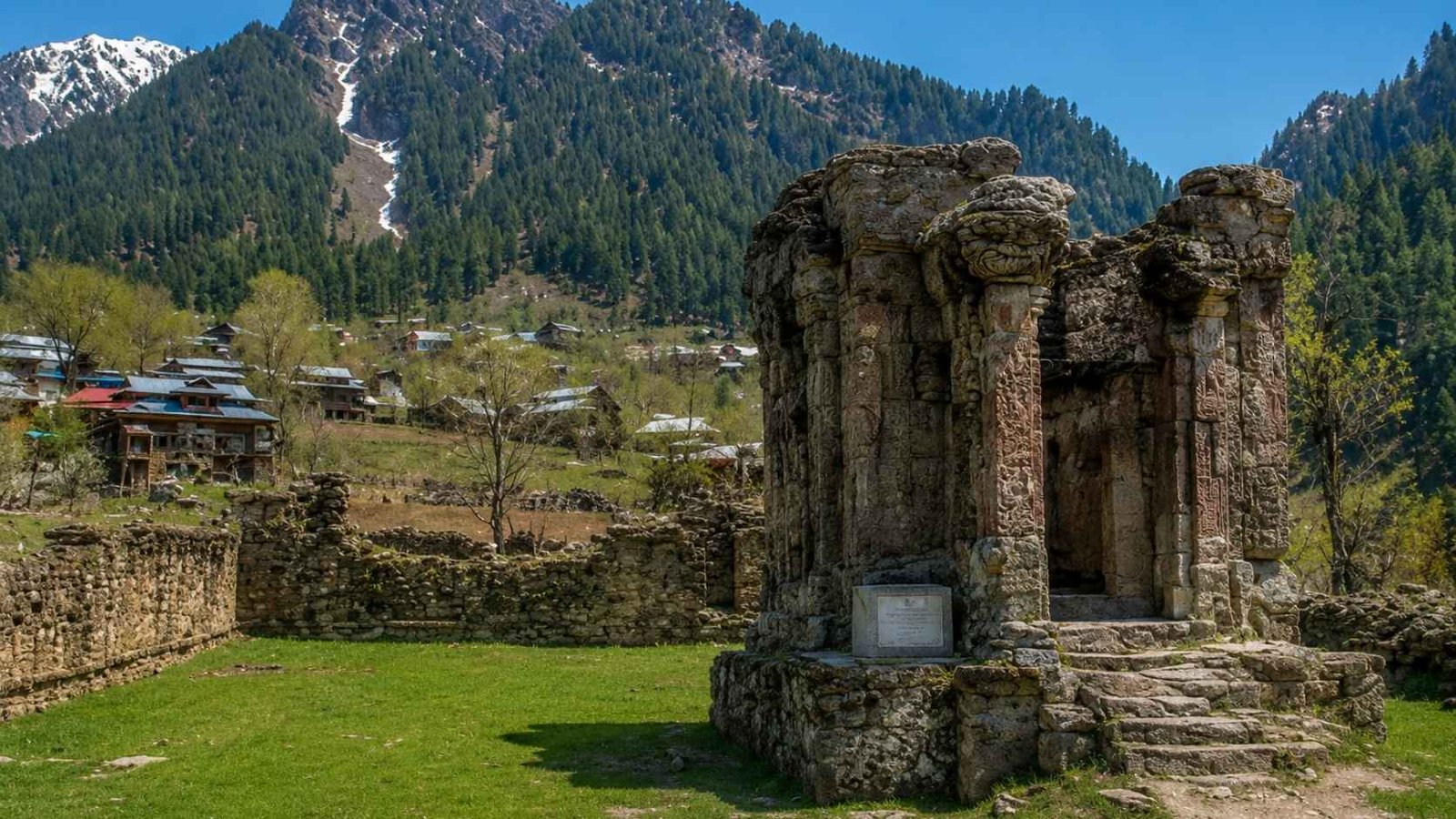 Sharda Peeth temple ruins in Pakistan-administered Kashmir with corridor milestone